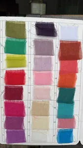Fabric color swatch card featuring twenty four various shades of bohemian voile cheesecloth for wedding.