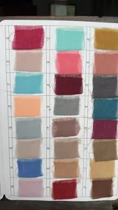 Cheesecloth table runner color swatch detail showing various fabric shades for wedding party decor.