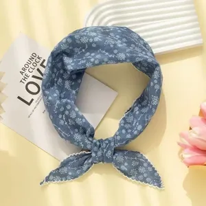 Floral triangle headscarf detail view, cotton linen fabric, hair accessory styling.