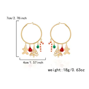 Detail view of Christmas hoop earrings with dimensions and gingerbread man charms
