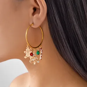 Detail shot of gold hoop earrings featuring Christmas charms on an Asian model.