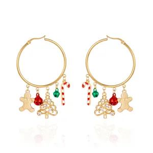 Detailed view of festive Christmas hoop earrings with gingerbread man and tree charms