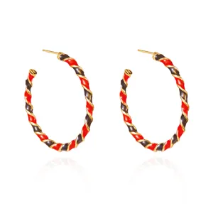 Elegant red and black twisted enamel hoop earrings with gold-tone finish for women