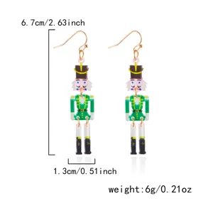 Detail view of festive Nutcracker acrylic earrings showing dimensions 6.7x1.3cm and 6g weight
