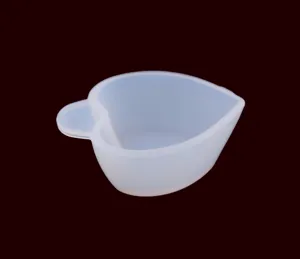 Detailed view of a translucent silicone heart-shaped mixing cup for DIY resin crafts and epoxy.