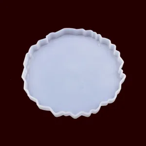 Close-up of irregular silicone mold detail, flexible resin coaster casting tool surface.