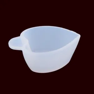 Detail view of heart-shaped silicone mixing cup for DIY resin crafts, clear and flexible.