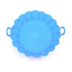 Blue silicone air fryer pot detail view featuring side handles and corrugated rim design.