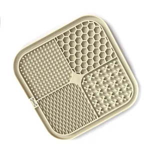 Tapis de léchage lent en silicone pour animaux avec quatre quadrants texturés pour chiens.