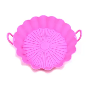 Close-up detail of the pink silicone air fryer pot showing textured ribbed bottom design.