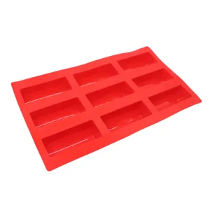 Detail view of a red 9-cavity silicone baking mold for delicious mousse and tiramisu desserts.