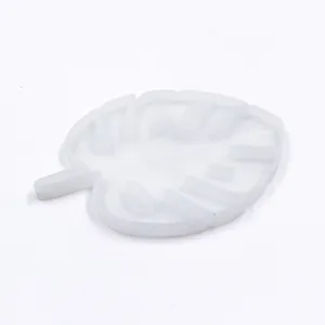 Detail shot of translucent silicone monstera leaf mold for DIY resin crafts and coasters.