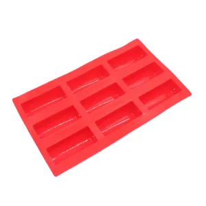 Detailed view of the 9-cavity red silicone baking mold for chocolate mousse and desserts.