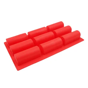 Detail view of 9-cavity red silicone baking mold, showing flexible texture and structure.