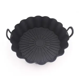 Black silicone air fryer pot detail showing fluted edge and heat-resistant handles.