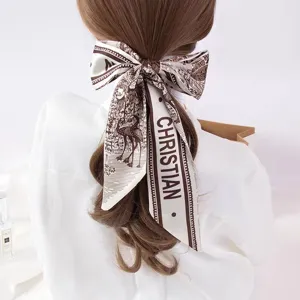 Elegant long silk hair ribbon scarf with vintage pattern for women hair styling and bag decor.