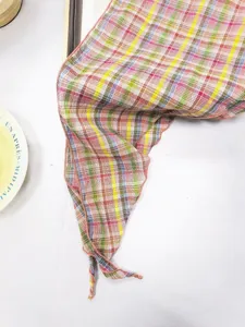 Detailed close-up of a colorful plaid triangle scarf, retro pastoral style neckerchief for daily wear.