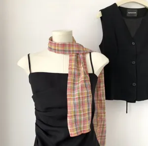 Detailed shot of the colorful plaid silk scarf, retro French pastoral style neckerchief.