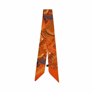 Elegant orange narrow silk twilly scarf, versatile bag ribbon and chic hair accessory for women.