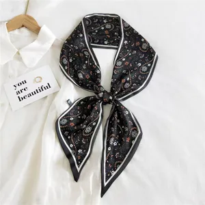 Floral print narrow silk scarf for women, elegant black long twilly ribbon for bags or neck styling.