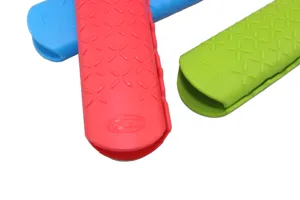 Silicone pot handle cover detail shot, high temperature resistant kitchen accessory, non-slip.