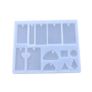 Detail view of transparent silicone mold showing various geometric shapes for pendant crafting