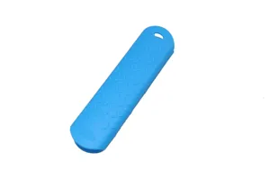 Silicone skillet handle cover detail, embossed anti-slip texture, blue kitchen tool.