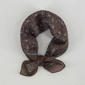 Close-up detail of the brown paisley printed square scarf, elegant fabric texture.
