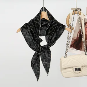 Black white plaid knit scarf detail view, elegant diamond shape neckerchief for chic styling.