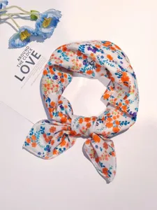 Close-up detail of floral cotton linen square scarf, artistic small neckerchief styled nicely.