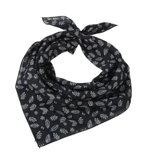 Detailed close-up of the black cotton linen square scarf featuring white leaf and floral print.