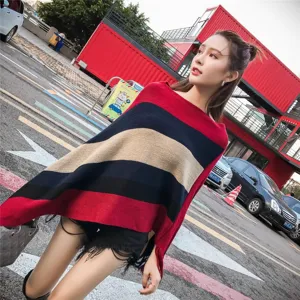 Chic striped knitted poncho shawl featuring elegant asymmetric fringe details for women
