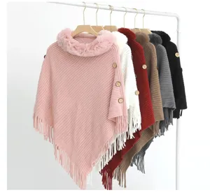Cozy knitted ponchos with faux rabbit fur collars and tassel fringe in various colors