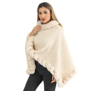 Women's chic beige knit poncho with luxury faux fur collar and irregular hem
