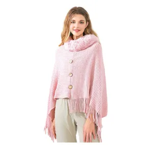 Pink knitted poncho with soft faux rex rabbit fur collar and decorative tassels