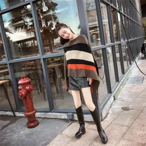 Stylish striped asymmetric knit poncho with fringe and casual street style