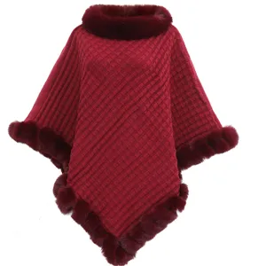 Wine red knitted pullover poncho with fluffy faux fur collar and irregular hem details