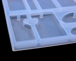 Silicone mold detail shot for DIY resin necklace pendant crafts, translucent geometric shape.