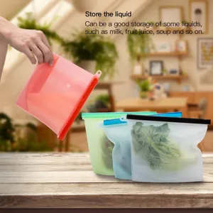 Reusable silicone food storage bag for liquids, fruits, and vegetables in kitchen.