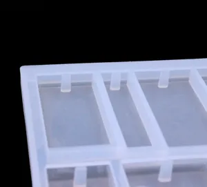 Close-up view of the translucent silicone mold detail, showing precise cavity structure for jewelry.