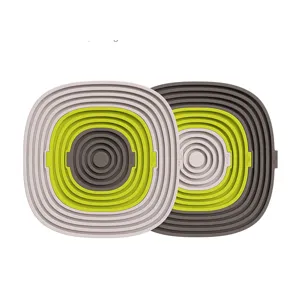 Vista detallada de la alfombrilla de silicona aislante con diseño plegable flexible.