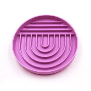 Purple silicone slow feeder dog bowl detail, anti-choking pet slow food food design closeup.