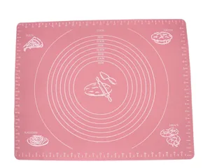 Close-up detail of pink silicone baking mat with measurement scales and concentric circles.