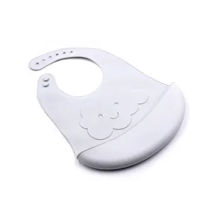 Silicone baby bib detail showing soft grey texture, adjustable buttons and waterproof crumb pocket.