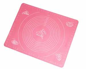Detail view of pink silicone kneading mat with baking scale and concentric circles.