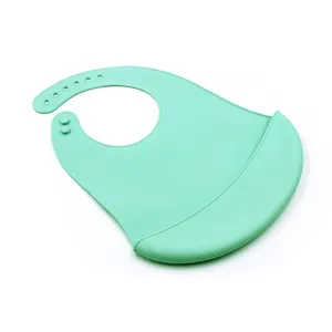 Mint green silicone baby bib detail showing soft waterproof pocket and adjustable neck strap.