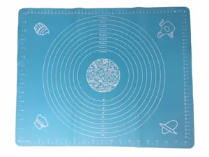 Silicone baking mat detail showing clear measurement scales in centimeters and inches for precision.