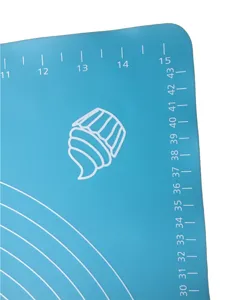 Silicone baking mat detail view showing clear measurement scales and cute cupcake icon design.