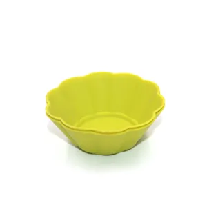 Details of yellow silicone muffin cup, flexible flower-shaped baking mold for daily use.