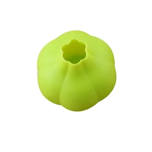 Silicone garlic peeler kitchen tool, flexible green garlic peeling tube for easy cooking.